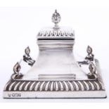 An Edwardian silver swept square inkwell, with gadrooned rim, 90mm h, marks rubbed, Sheffield 1903