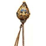 A gold stickpin, with gold and enamel octahedron terminal