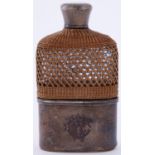 A Victorian silver mounted glass hip flask, with wicker covered shoulder, detachable cup, 11.5cm,