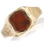 A gold signet ring, set with shield shaped cornelian, 4.3g, size P