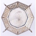 A George V octagonal silver sweetmeat dish, with trellis pierced sides on four swan headed scrolling
