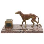 A bronzed spelter sculpture of a greyhound, mounted on breccia marble inkstand, beside brass and