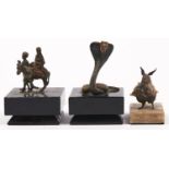 A cold painted bronze model of a hooded cobra, black painted wooden base, cobra 9.5cm h; a cold