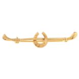 A 9ct gold riding crop brooch, 1.9g