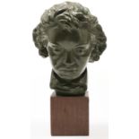 A bronze painted plaster sculpture of the head of Beethoven, wood base, 40cm h, inscribed on the
