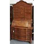 A walnut bureau cabinet, in early 18th c South German style, 20th c, 104cm l