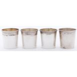 A set of four Victorian silver whisky tots, with moulded rim, the interior gilt, 34mm h, by Edward