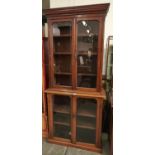 A Victorian walnut bookcase, late 19th c, rosewood stained, the upper part with dentil cornice above