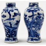 Two similar Chinese blue and white baluster vases, late 19th / early 20th c, painted with bird and