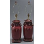 A pair of Chinese flambe vases, mounted as table lamps, with branching peach handles, wood base,