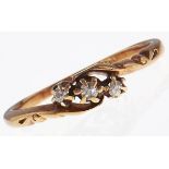 A three stone diamond ring, in 18ct gold, 1.9g, size L Wear consistent with age