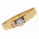 A diamond solitaire ring, in bark textured gold marked 18ct, 3.4g, size Q½ Good condition