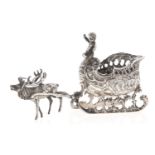 A Dutch miniature silver model of a sleigh, of shell shape, pulled by a reindeer, 13.5cm l,