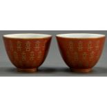 A pair of Chinese coral ground gilt wine cups, 55mm h, Tongzhi mark Good condition
