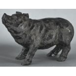 A black resin sculpture of a pig, 20th c, 15cm h Good condition