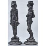 A pair of French patinated spelter figural caricature candlesticks of soldiers, late 19th c, on
