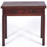 A George III mahogany tea table, 18th c, the fold-over top with moulded lip above two drawers, on