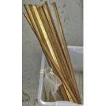 A set of Edwardian brass stair rods and a quantity of brass stair rod clips, rods of triangular