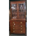 A George III mahogany secretaire bookcase, early 19th c, the upper part fitted with adjustable