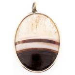 A gold framed oval agate pendant Slight wear