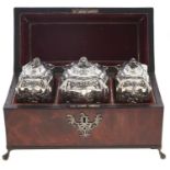 A set of George III silver tea caddies and covers, including a sugar box, of typical serpentine