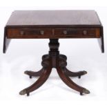 A George IV mahogany sofa table, on quadruple legs with brass paw castors, 132cm l Minor old repairs