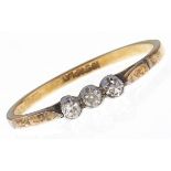 A three stone diamond ring, in gold marked 18ct & PLAT, 2g, size N Light wear