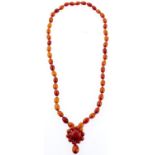A necklace of amber beads, 32g