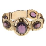 A Victorian purple paste and giltmetal bracelet, c1870, 15.5cm l Complete and in good condition,