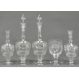 A pair of British glass decanters and stoppers and a pair of smaller decanters en suite, c1900,