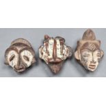 Tribal Art.  Three African pottery spirit heads, with white pigment decoration, 12cm and c Pigment