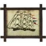 A Victorian sailor's woolwork picture of a ship, late 19th c, 40.5 x 52cm, in the original trampwork