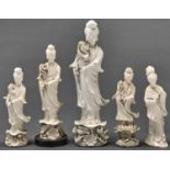 Four blanc de chine figures of Guanyin and one other, 20th c, 35cm h and smaller Largest figure