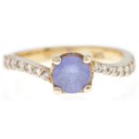A tanzanite  and diamond ring, in gold marked 14k, 3.9g, size O Good condition