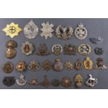 Miscellaneous British army cap badges, including Manchester Regiment, and other items (30)