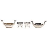 Two Norwegian silver longship novelty salt cellars and a pair of George V silver salt cellars with