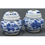 A pair of Chinese blue and white opium type vases, painted with dogs of Fo, 11cm h, painted shou