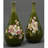 A pair of Doulton Lambeth faience vases, 1891-1914, painted by Alice Marshall with wild roses on a