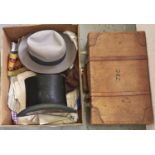 Various hats, including a top hat, a leather suitcase, etc