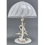 An Italian silver plated dolphin lamp by Ottadiani, the dolphin wrapped cylindrical column with wave