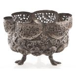 An Indian silver pierced repousse sugar bowl, late 19th / early 20th c, of cusped form, decorated