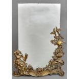 A cast brass  rococo revival easel mirror, early 20th c, with brass strut and frameless plate,