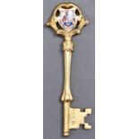 A George V silver gilt and enamel ceremonial key, engraved Blyth Fire Station Presented by Messrs