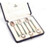 A set of six Scandinavian silver gilt and green guilloche enamel coffee spoons, c1920, maker's mark,