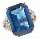 A blue topaz cocktail ring, with diamond shoulders, in gold marked 375, 8.3g, size M Good condition