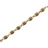 A diamond bracelet, with lozenge shaped links, in gold marked 750, 13.2g Good condition