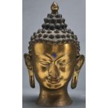 A reproduction Thai bronze Buddha head, with applied blue Urna, snail shell curls and domed top