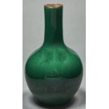 A Chinese green monochrome glazed vase, of bottle shape, 17cm h Good condition