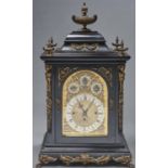 A German brass mounted ebonised bracket clock, late 19th c, with arched dial, silvered chapter