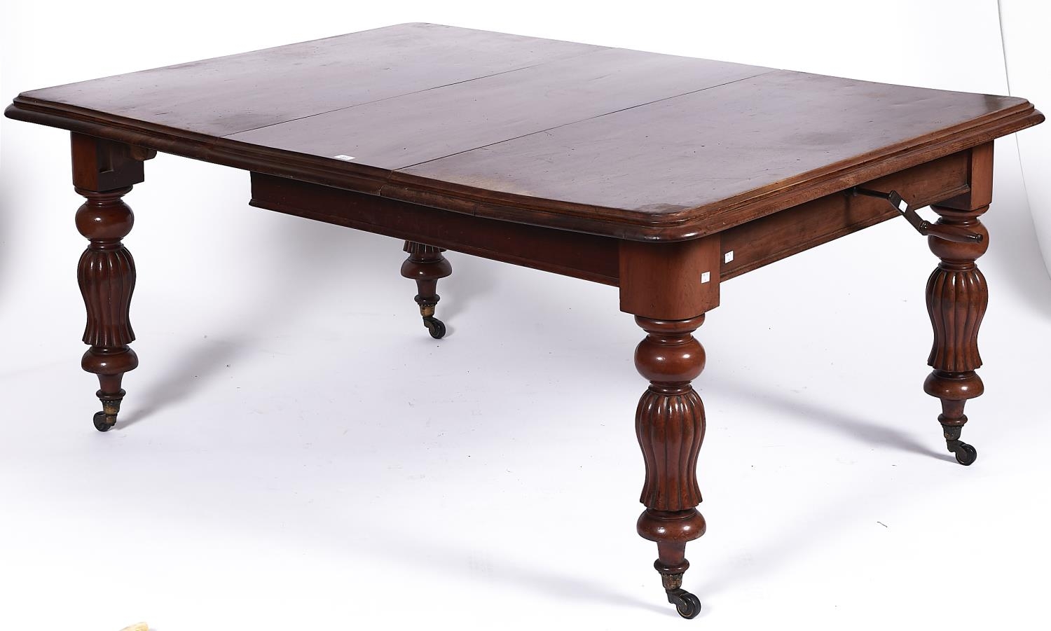 A Victorian mahogany single leaf extending dining table, the rounded rectangular top with moulded